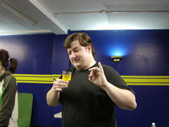 Brad shows us the polite way to drink a glass of piss.  Pinkies up!